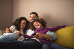 african american family lounging on couch