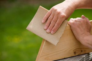 Sanding a wooden board